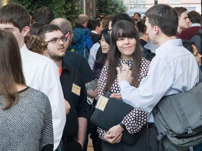 a crowd speaking and networking with each other at Kelly Engineering Center