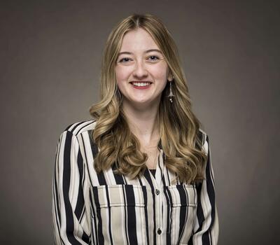 A Person taking smiling at the camera