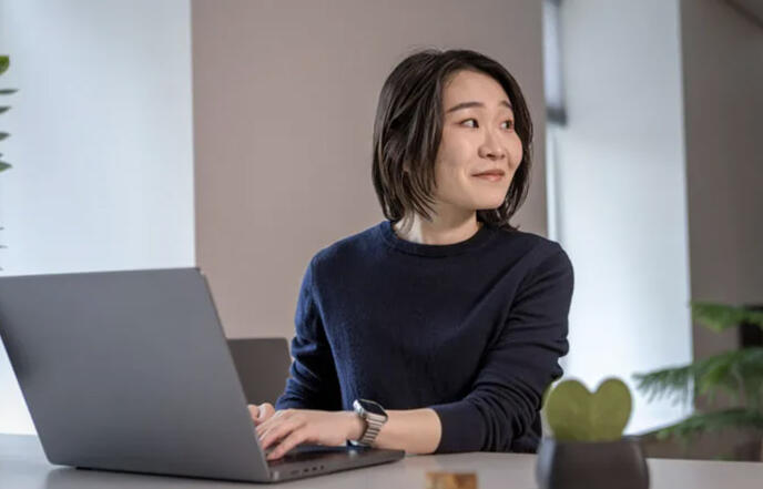 A person working in front of a laptop.
